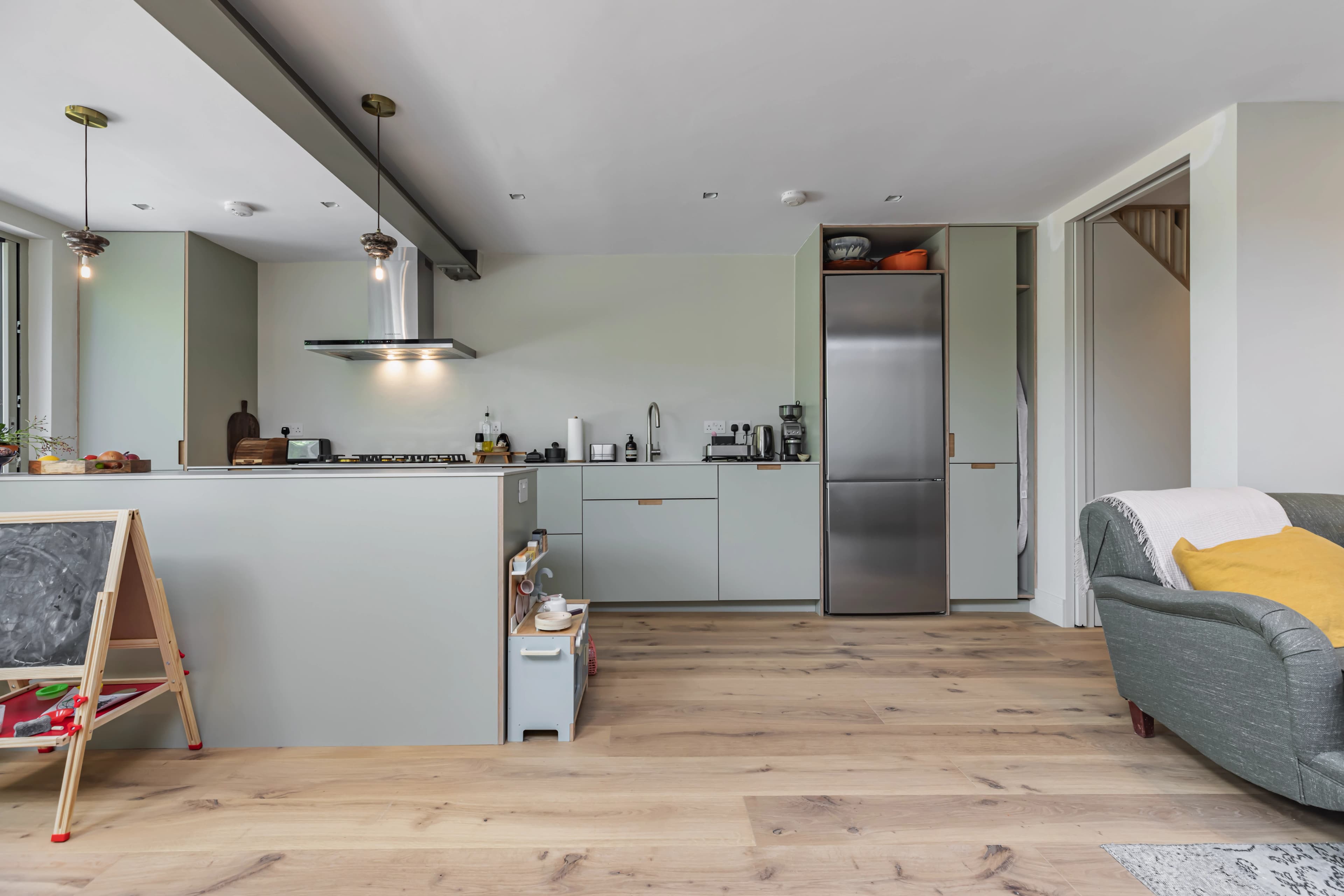 A finished Better Homes kitchen with pale cabinetry and oak flooring