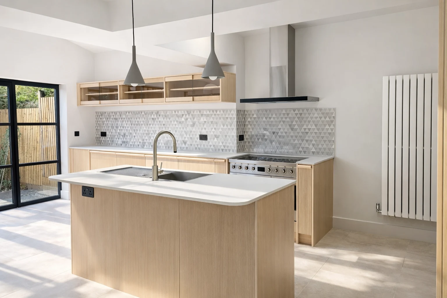 Pale kitchen island, range cooker and pendant lighting