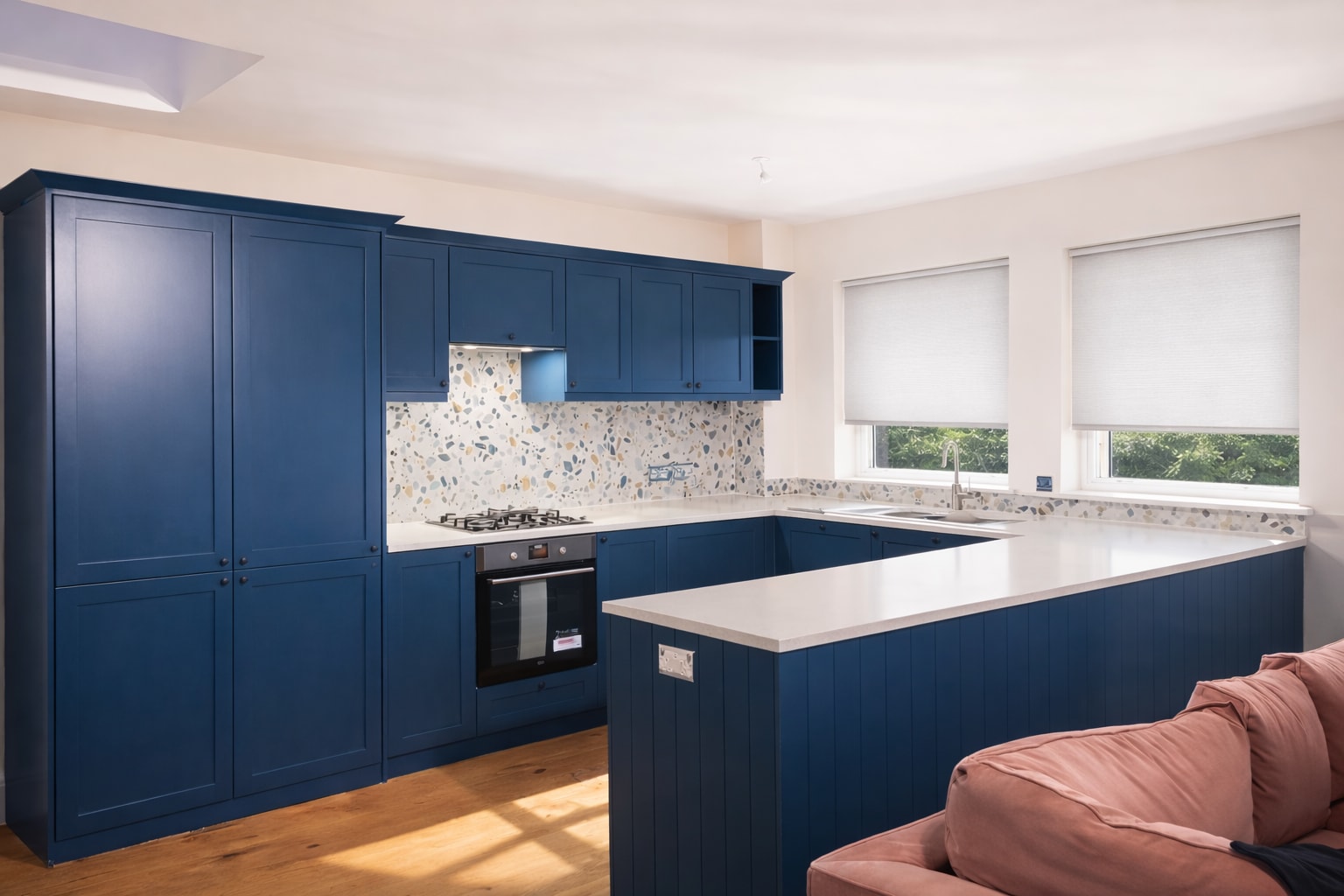 Blue kitchen and adjacent living space