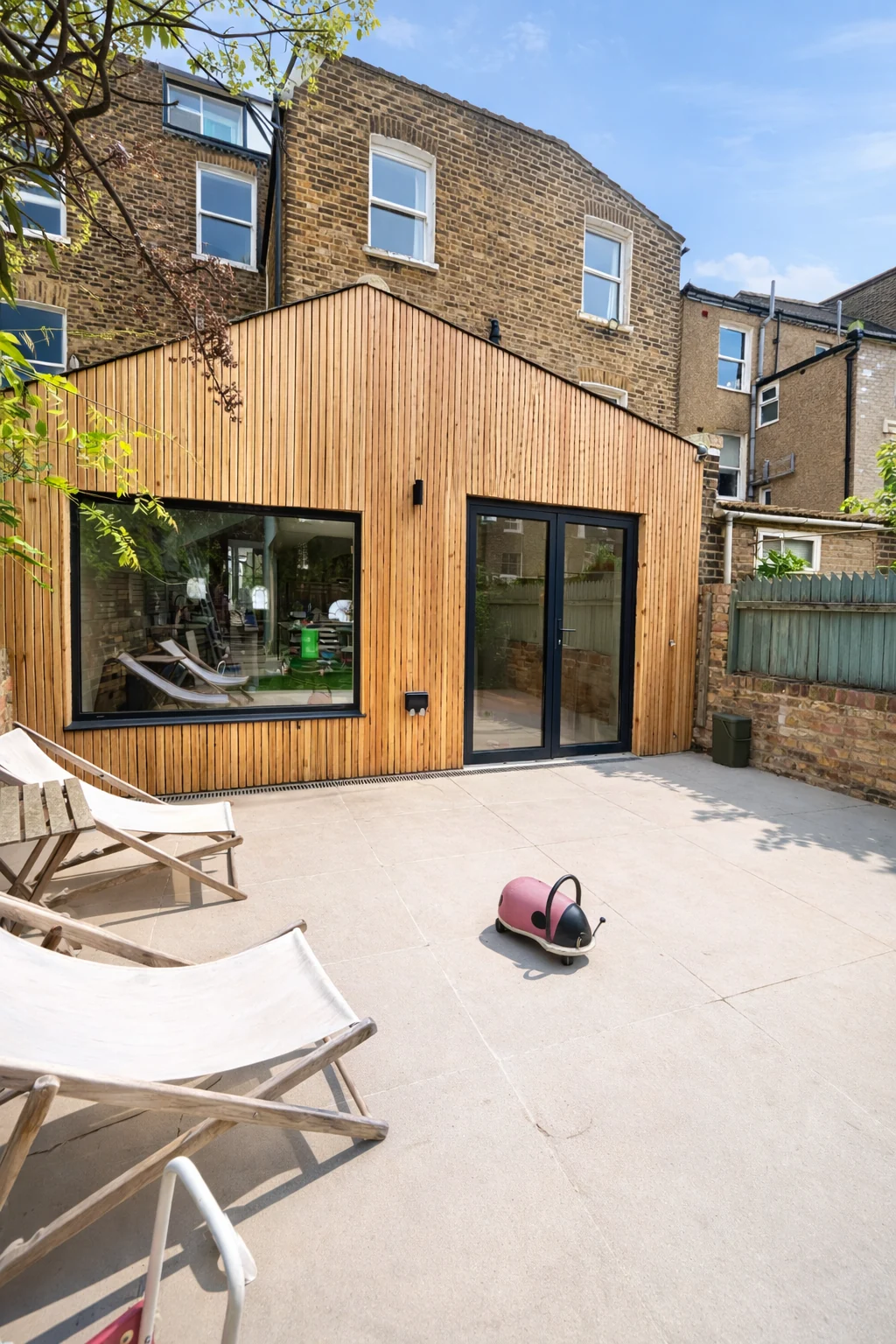 Timber-clad rear extension opening to the garden